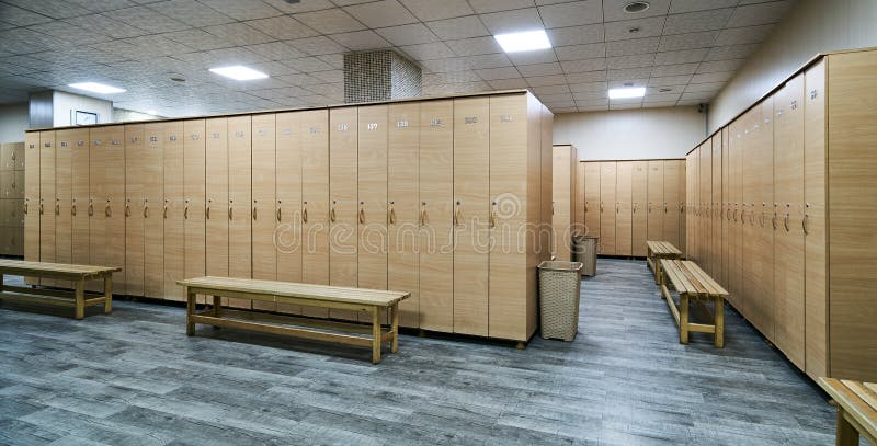 Wooden lockers with a wood bench in a locker room