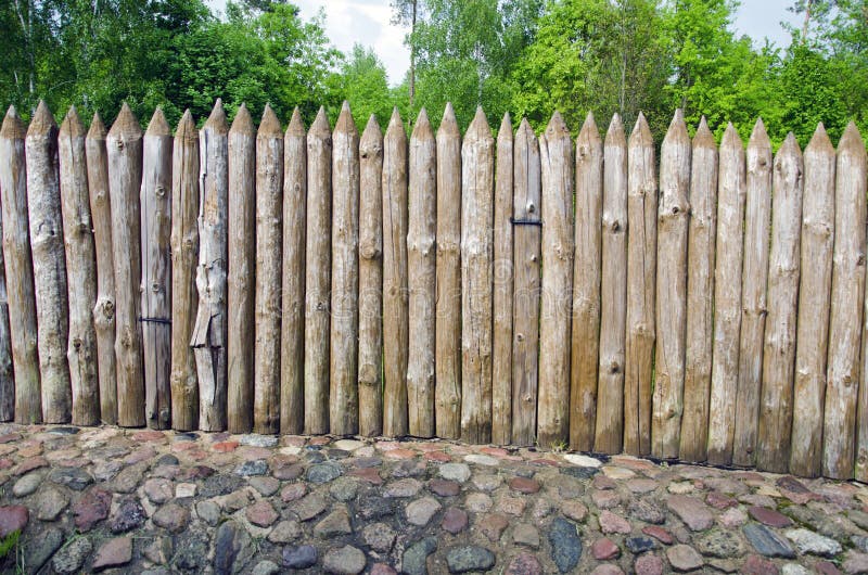 Wooden log fence in resort park