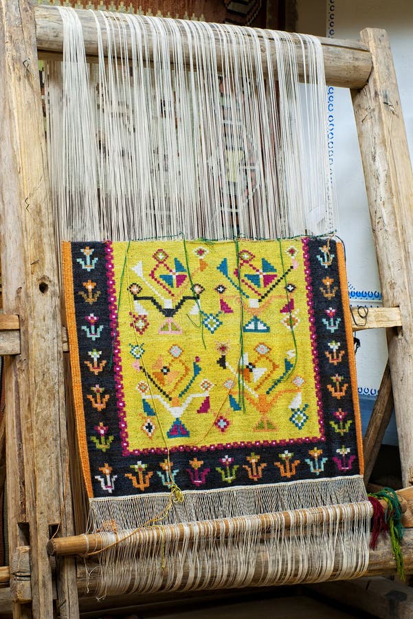 Wooden loom with carpet