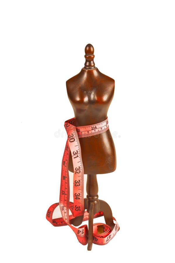 Wooden mannequin with measuring tape of the tailor
