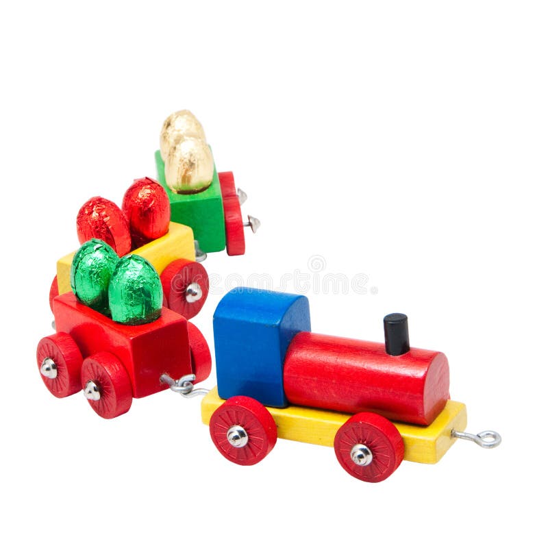 Wooden model railway with easter eggs on wagons stock images