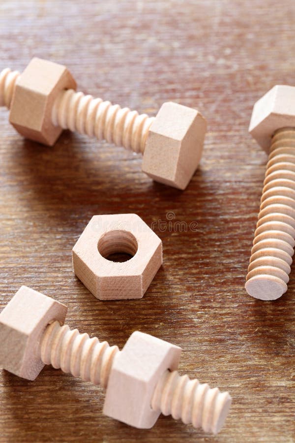 Wooden Nuts and Bolts stock photo. Image of play, trio 6892708