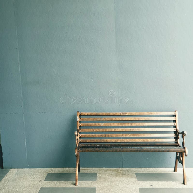 Wooden park chair indoor with blue wall colors