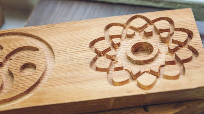 Wooden part blank with 3D patterns. Wood Details after processing on cutting machine, 3D wood cnc router. Cutter controlled by royalty free stock photo