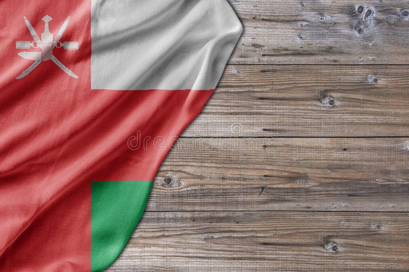 Wooden pattern old nature table board with Oman flag royalty free stock photo