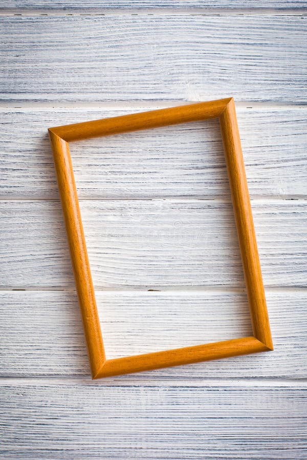 Wooden picture frame on old wooden background