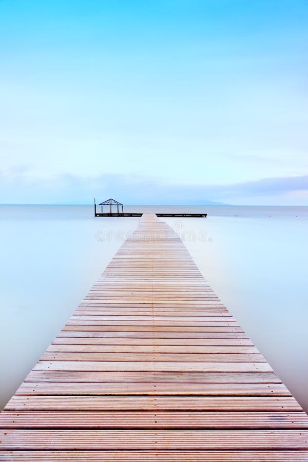 Wooden pier in a cold atmosphere. Tuscan coast.