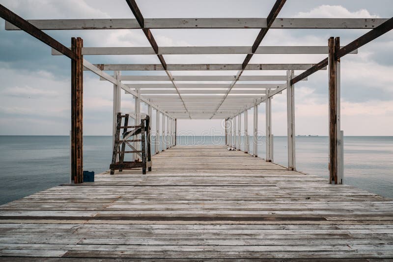 Wooden pier and sea, perspective, corridor view with no people royalty free stock photos Wooden pier and sea, perspective, corridor view with no people royalty free stock photos