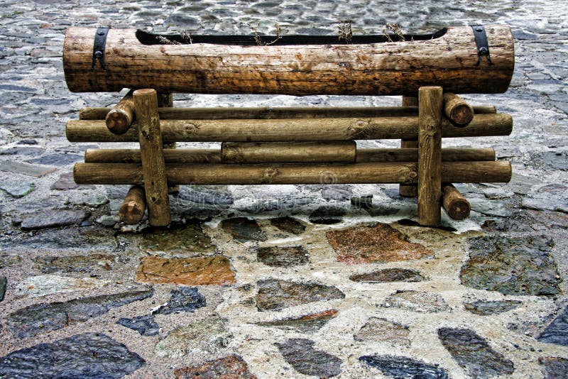Wooden planter made of trunks stock images