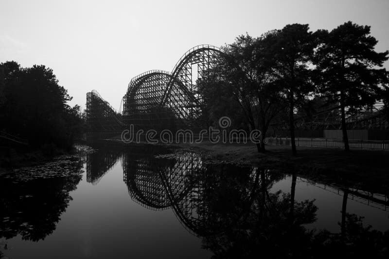 Wooden rollercoaster, trees and a lake