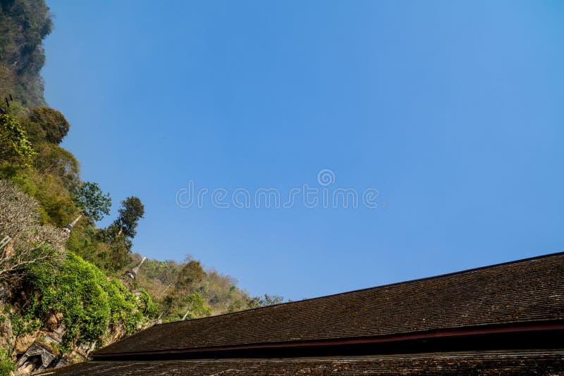 Wooden rooftop of an ancient Buddhist temple with clear blue sky background. royalty free stock images Wooden rooftop of an ancient Buddhist temple with clear blue sky background. royalty free stock images