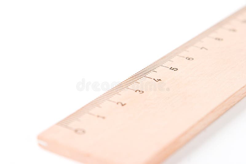A wooden ruler with a white ba