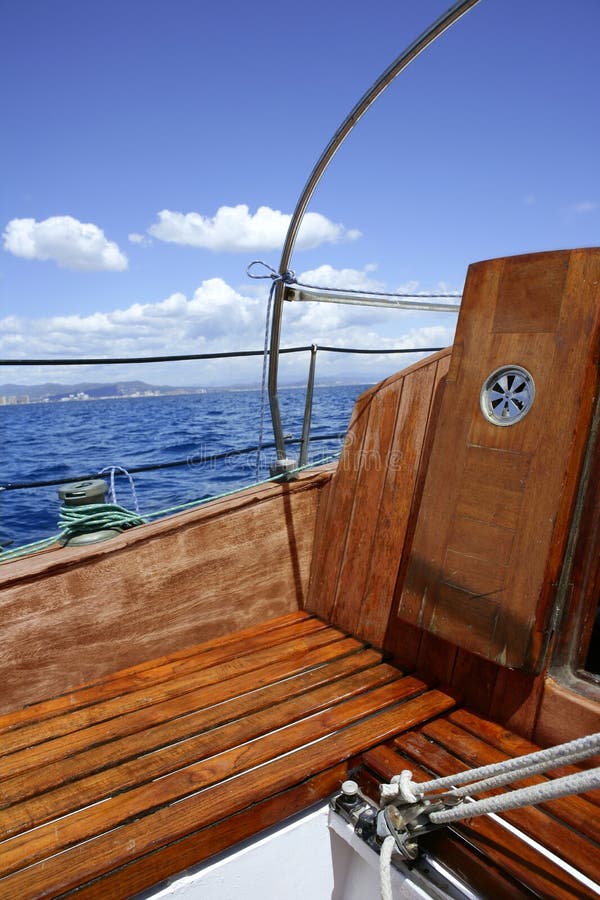 Wooden sailboat boat deck blue sky ocean sea