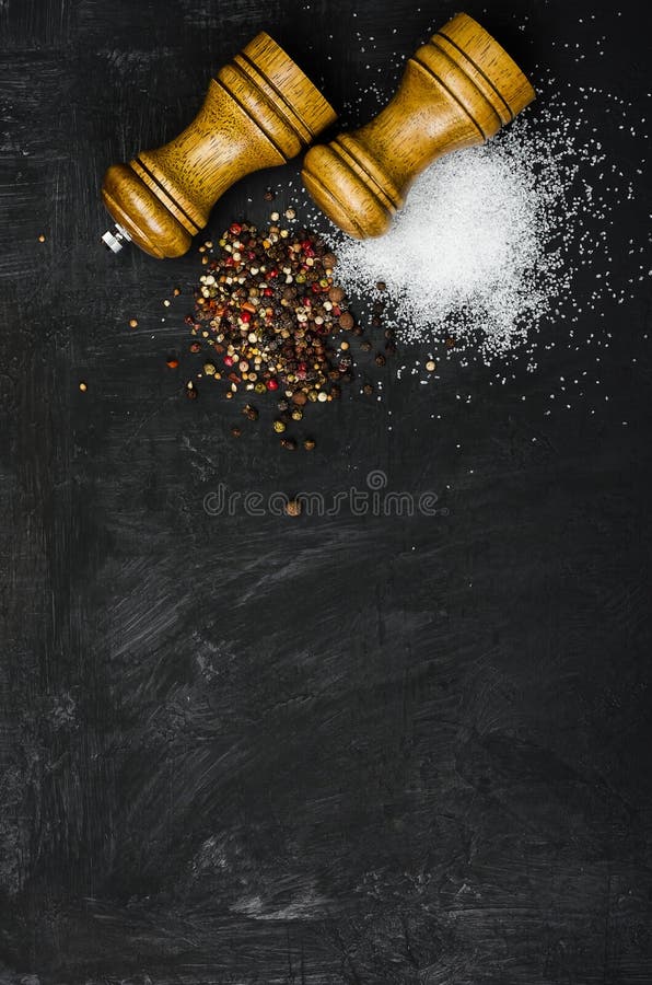 Wooden salt shaker and pepperbox on a light background. Stock Photo by  ©ellymorena 238801336