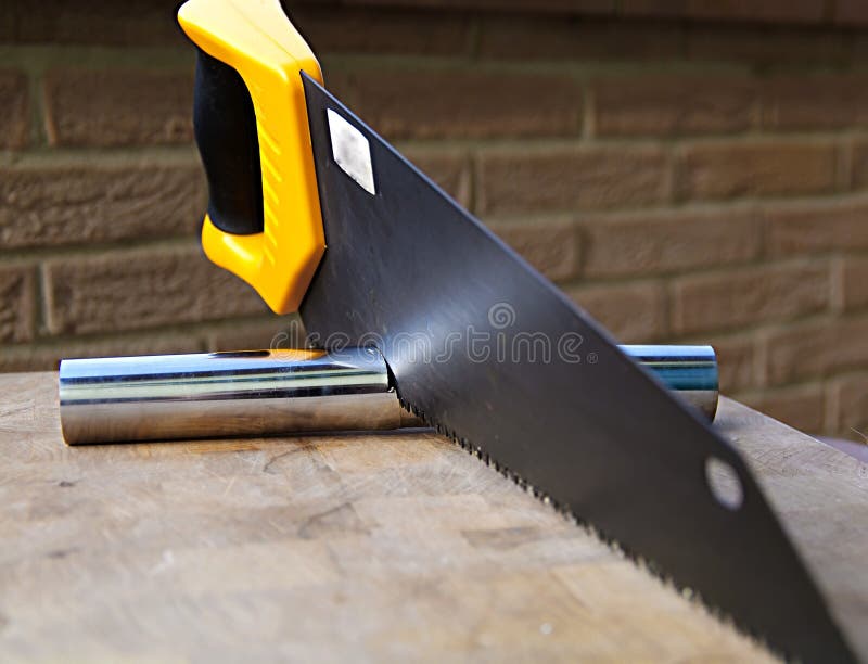 Wooden Saw Used for Cutting a Metal Pipe Stock Photo Image of