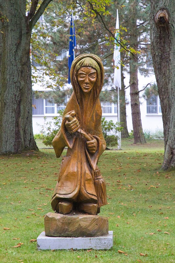 The wooden sculpture of the good witch Plaulina was made with a power chainsaw by the Lithuanian artist Robertas Keliauskas royalty free stock photos The wooden sculpture of the good witch Plaulina was made with a power chainsaw by the Lithuanian artist Robertas Keliauskas royalty free stock photos