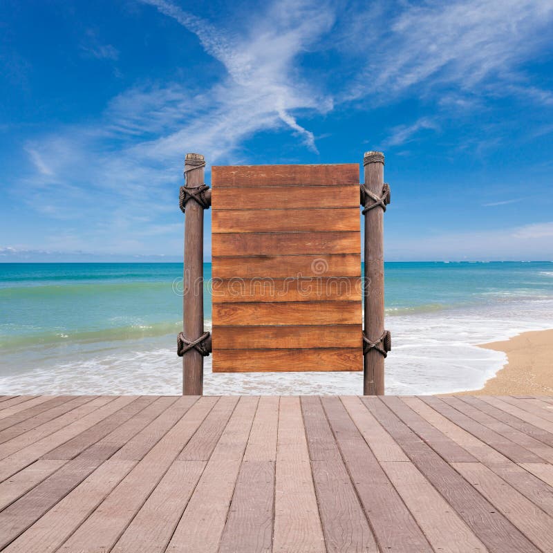 wooden signboard and wood floor on beach for summer background.