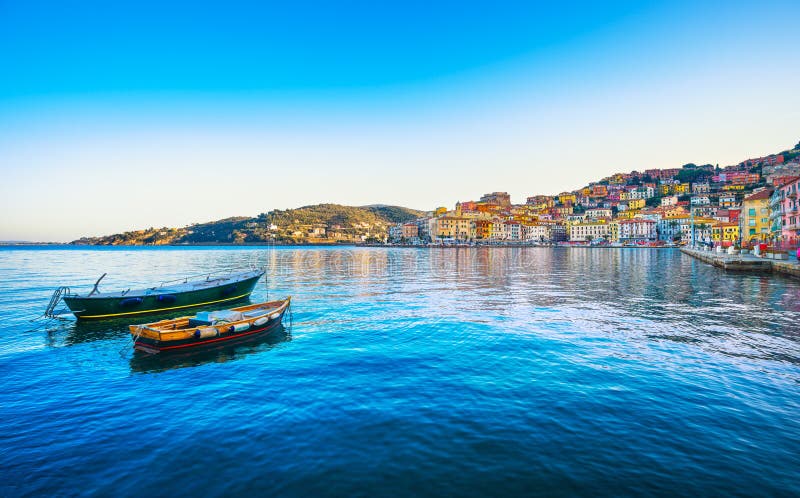 Wooden small boats in Porto Santo Stefano seafront. Argentario