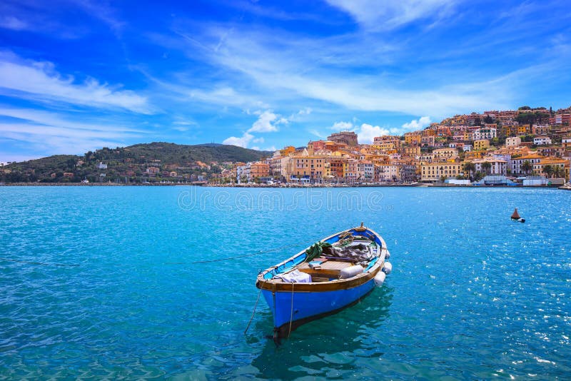 Wooden small boat in Porto Santo Stefano seafront. Argentario, Tuscany, Italy