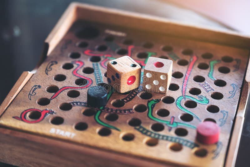A Wooden Snakes and Ladders Game Stock Photo Image of animal