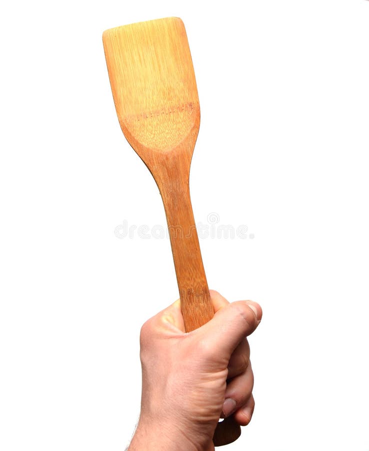 Wooden Spatula for Frying in Hand Isolated on White Background Stock