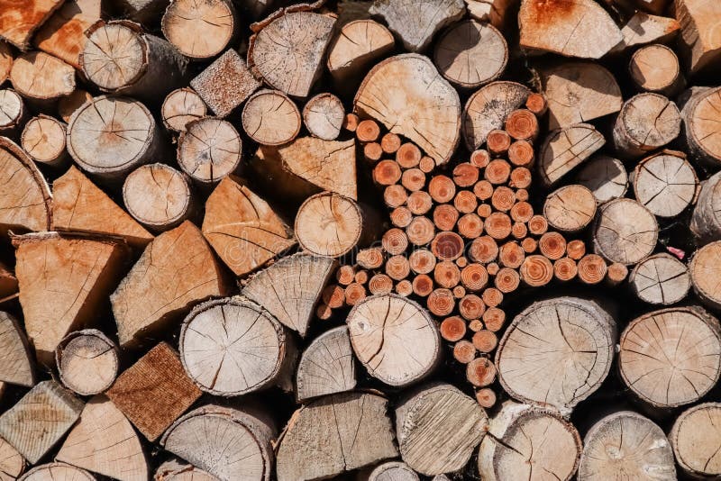 Wooden stack logs arranged and star shape in a wall. stock photo