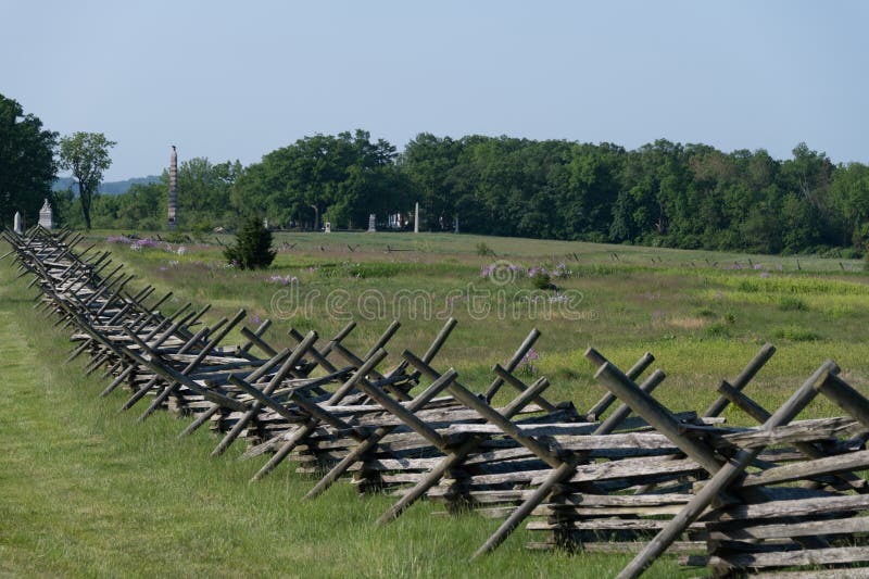 Wooden stacked fence. Gettysburg battlefield in the background. Pennsylvania royalty free stock images