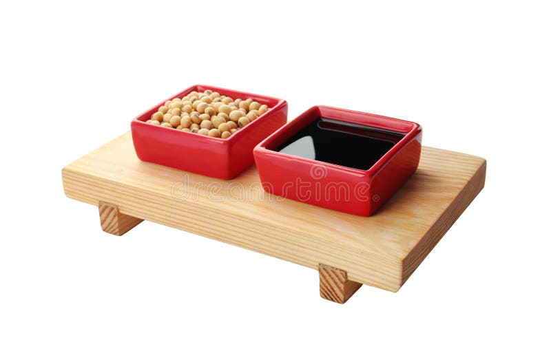 Wooden stand with dishes of soy sauce and beans on white royalty free stock photos Wooden stand with dishes of soy sauce and beans on white royalty free stock photos
