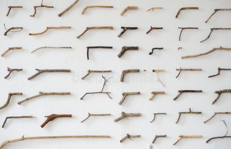 wooden-sticks-shape-guns-hanging-wall-wooden-sticks-shape-guns-hanging-wall-amsterdam-140166429.jpg