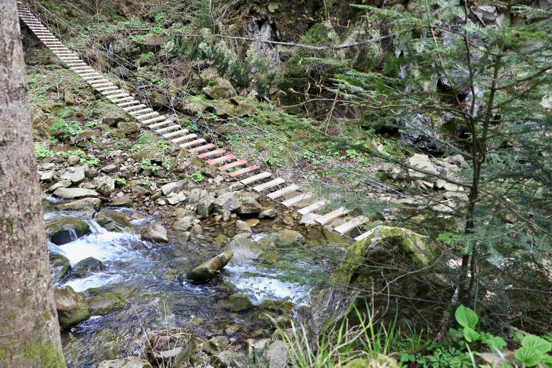 Wooden suspension bridge in the mountains royalty free stock images Wooden suspension bridge in the mountains royalty free stock images