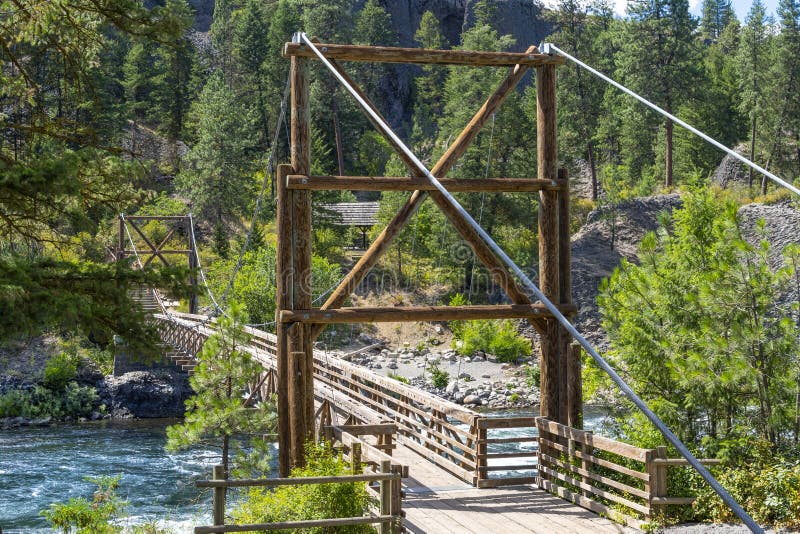 The wooden suspension bridge over the Spokane River at Riverside Park, Spokane Washington USA royalty free stock photo The wooden suspension bridge over the Spokane River at Riverside Park, Spokane Washington USA royalty free stock photo