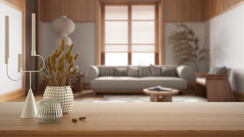 Wooden table, desk or shelf close up with ceramic and glass vases with dry plants, straws over blurred view of japandi wooden