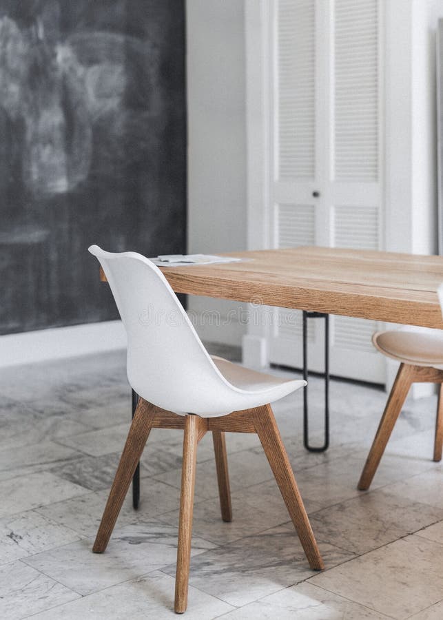 Wooden Table and White Chair on a Marble Floor Stock Image Image of