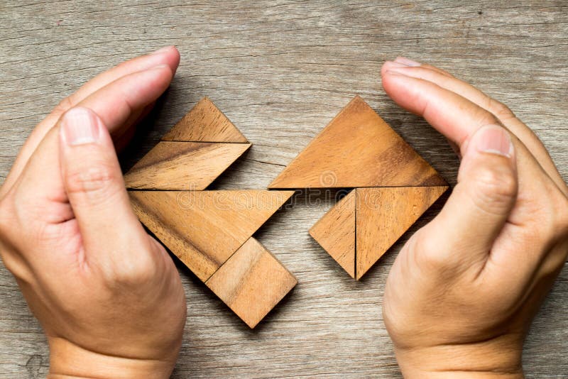 Wooden tangram puzzle in separate heart shape royalty free stock photos Wooden tangram puzzle in separate heart shape royalty free stock photos