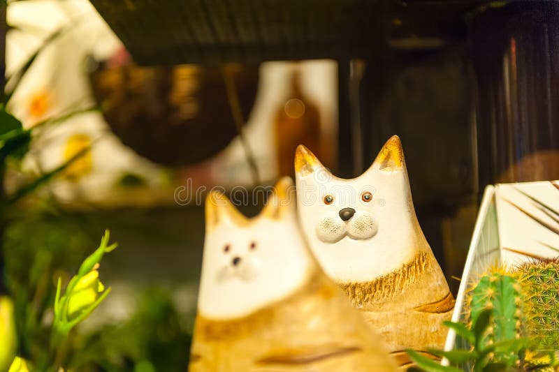 Wooden toy of cat for kids front view green background of the grass. The wooden toy of cat for kids front view green background of the grass stock photo Wooden toy of cat for kids front view green background of the grass. The wooden toy of cat for kids front view green background of the grass stock photo