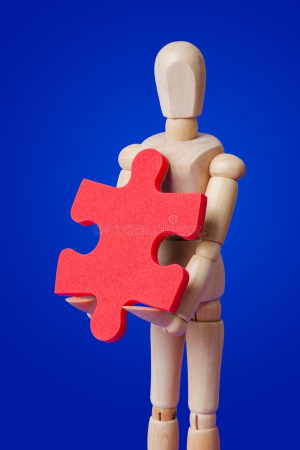 Wooden Toy Figure with Puzzle on Blue Stock Image Image of concept 146359007