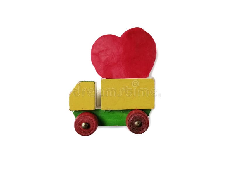 A wooden truck, red heart plasticine clay dough