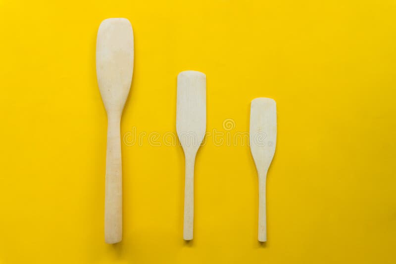 Wooden Turner Isolated Cooking Spatula With Yellow Background Stock Photo Image Of Cook Spatula 147930744