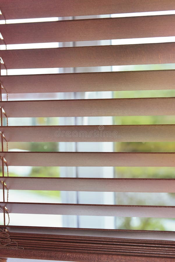 Wooden venetian blind on a window