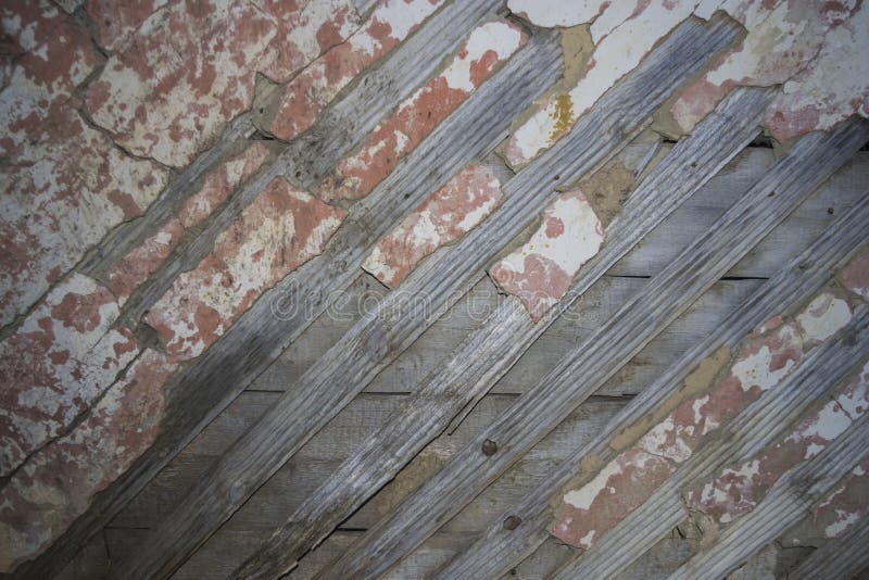Wooden wall from boards with plaster rests stock image Wooden wall from boards with plaster rests stock image