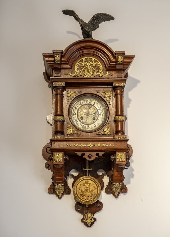 Wooden Wall Clock with a Pendulum of the 19th Century Stock Image