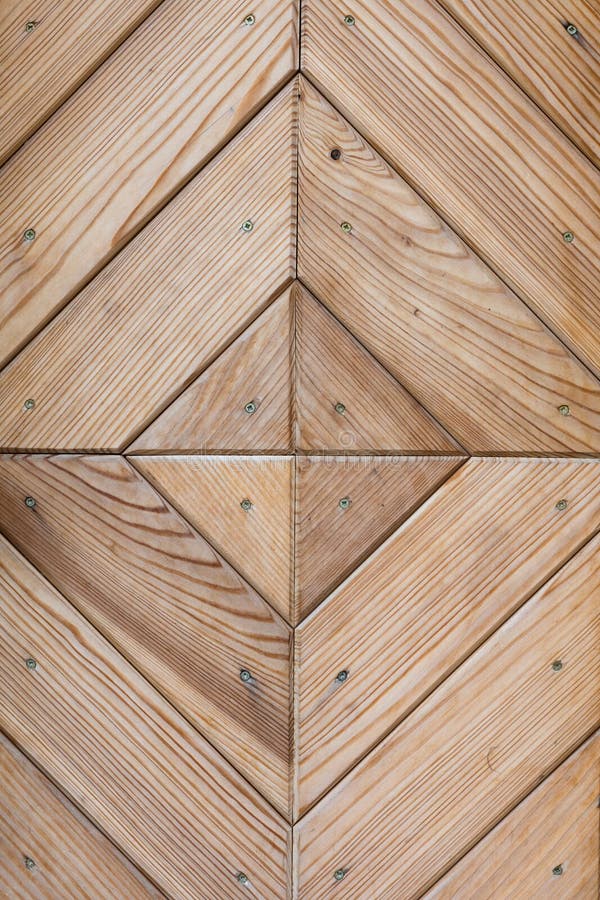Wall of Brown Natural Wood Arranged in a Geometric Pattern Stock Image