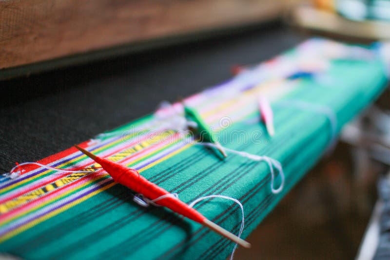 Wooden weaving shuttle for homemade silk weaving traditional thai fabric, Chiang Mai, Thailand