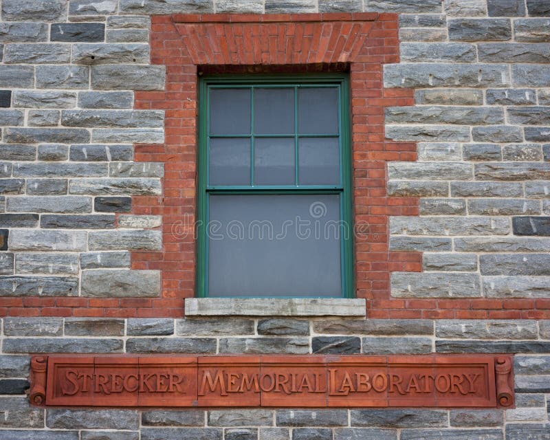 Wooden window, brick and stone wall