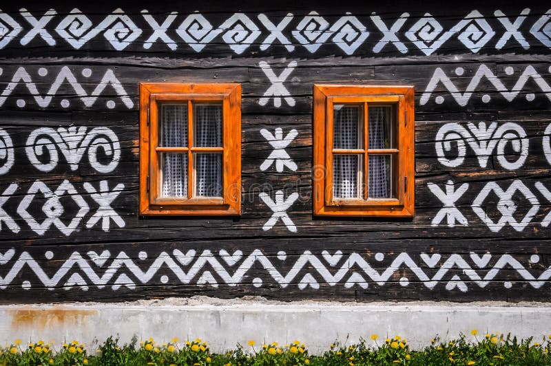 Wooden windows on wooden wall of wooden cottage