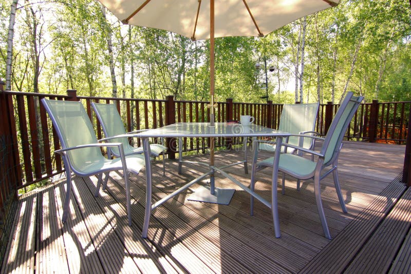 Woodland Deck and Patio Set Stock Photo Image of parasol, chairs