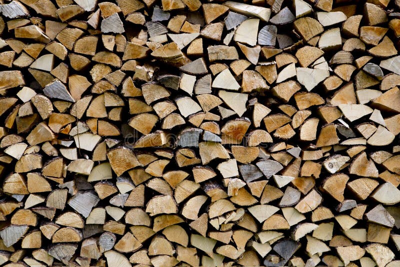 Woodpile are stacked from differen kind types