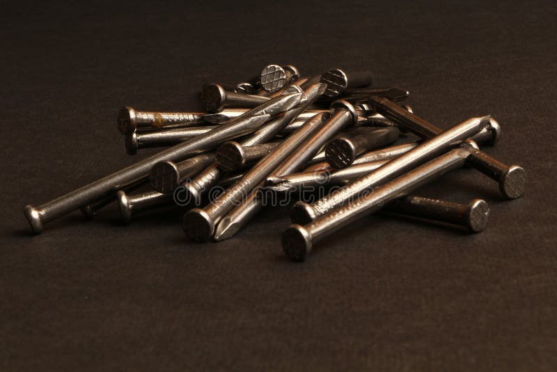 Metallic Iron Nails in Black Background Stock Image - Image of construction, dark: 156113345 Metallic Iron Nails in Black Background Stock Image - Image of construction, dark: 156113345