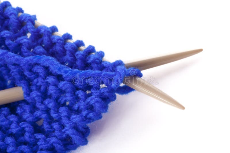 Blue wool and knitting needles