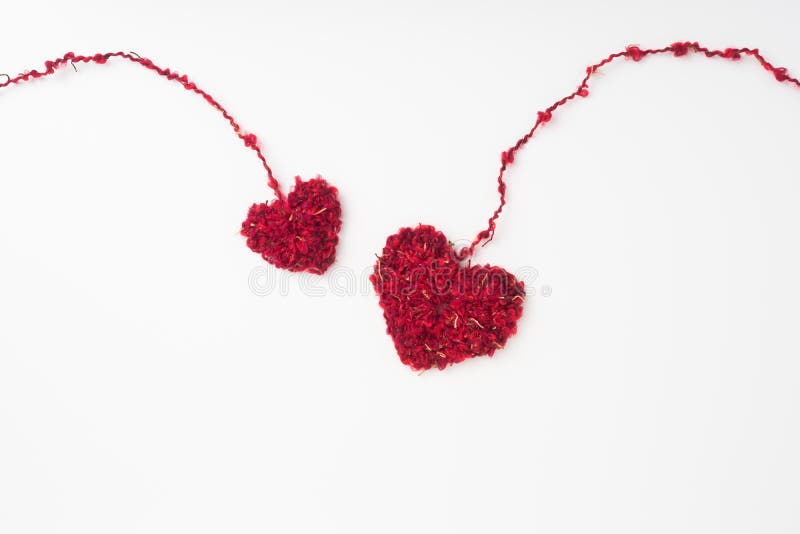 Wool weaved red heart with line isolated on white background royalty free stock photo Wool weaved red heart with line isolated on white background royalty free stock photo